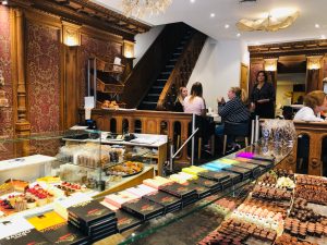 a room filled with furniture and vase on a table