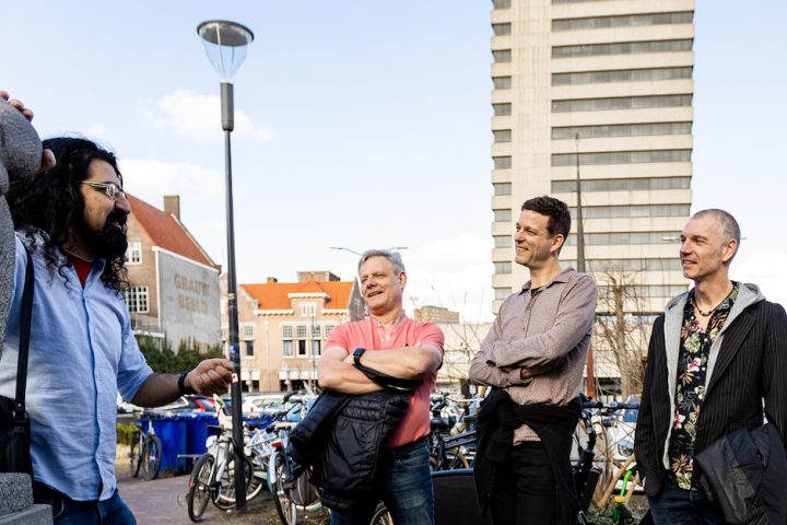 a group of people standing in front of a building