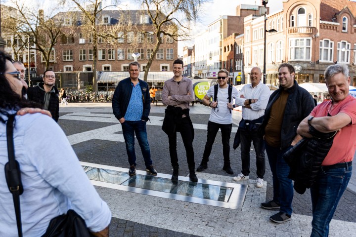 a group of people standing in front of a building