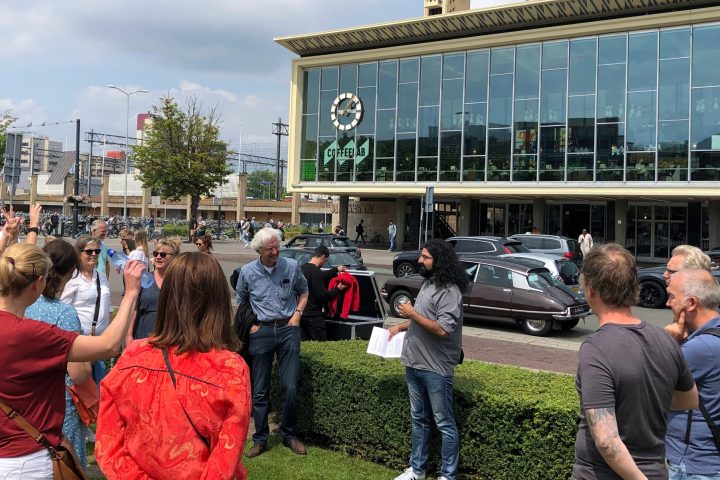 a group of people standing in front of a building