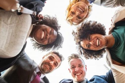 a group of people smiling for the camera